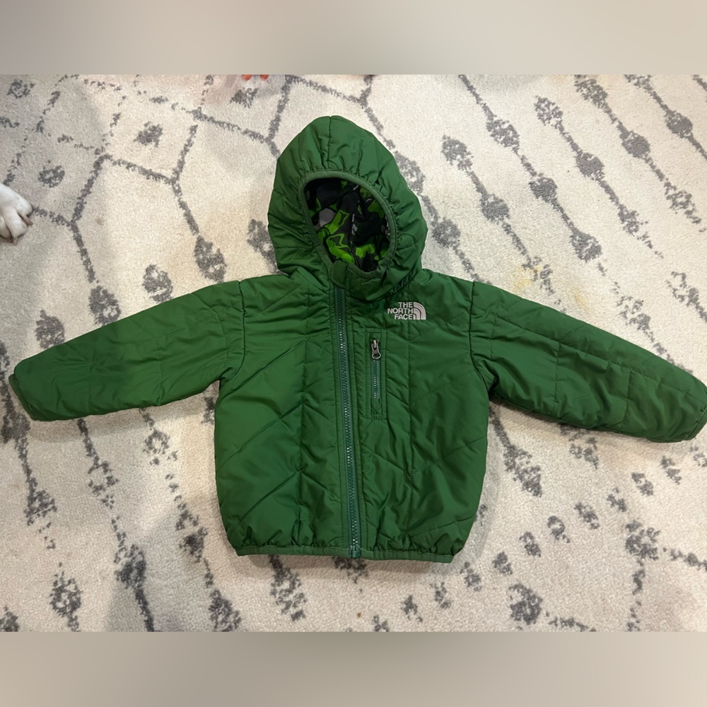 Lightly used 12-18 month reversible North face jacket with polar bears on one